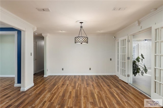 1500 Bryan Rd, Mission, TX 78572 - unfurnished dining area with wood finished floors, french doors, and crown molding
