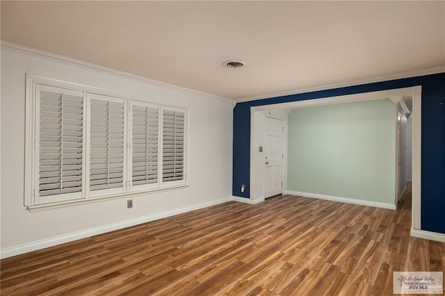 1500 Bryan Rd, Mission, TX 78572 - empty room featuring wood finished floors and crown molding