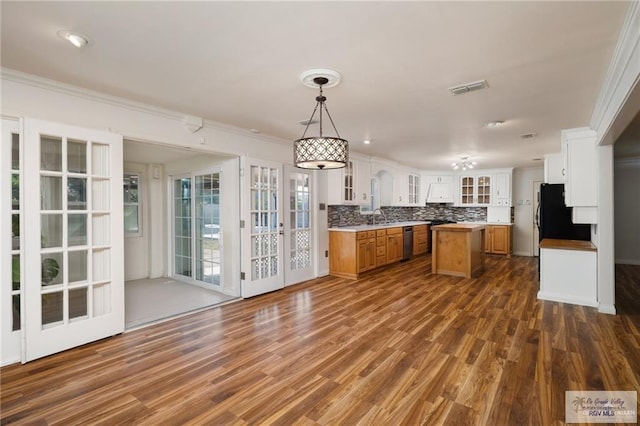 1500 Bryan Rd, Mission, TX 78572 - kitchen featuring dishwasher, fridge, a kitchen island, dark wood finished floors, and crown molding