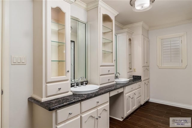 1500 Bryan Rd, Mission, TX 78572 - full bath with double vanity, wood finished floors, and crown molding
