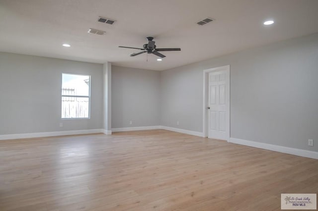 empty room with ceiling fan and light wood-type flooring