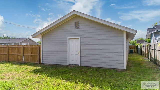 view of outdoor structure with a lawn