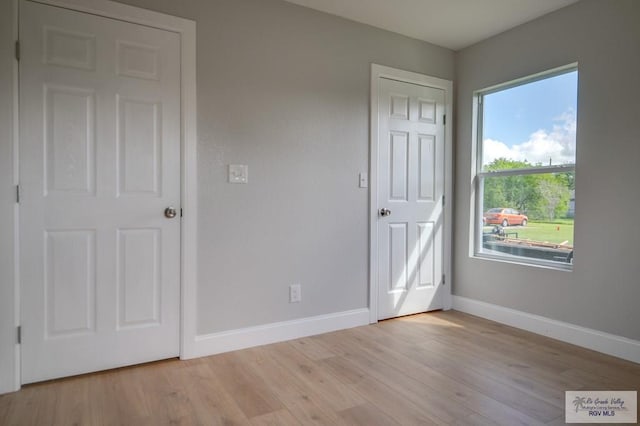 unfurnished bedroom with light hardwood / wood-style floors