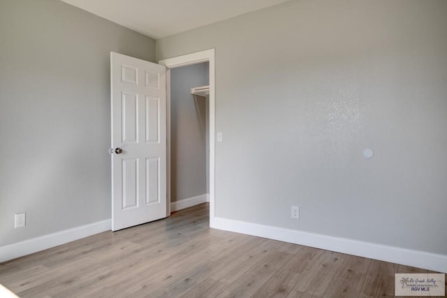 spare room featuring light wood-type flooring