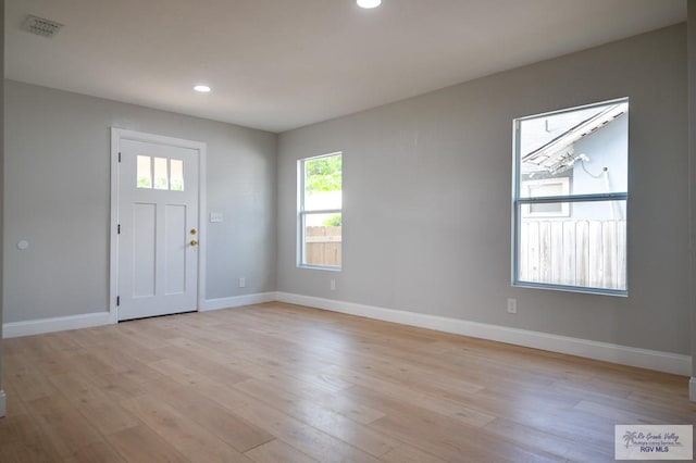 foyer with light wood-type flooring