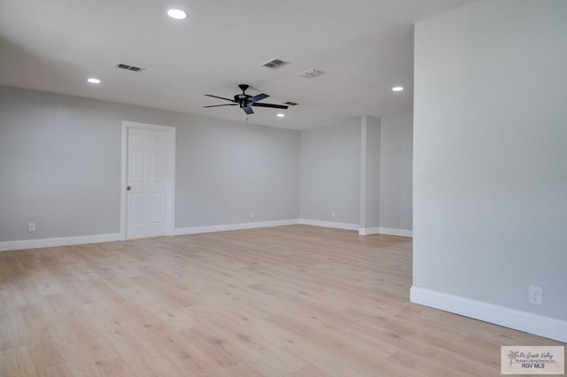 empty room featuring ceiling fan and light hardwood / wood-style floors