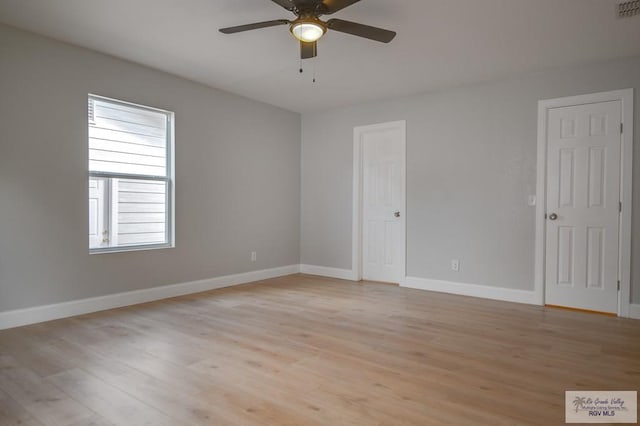 spare room featuring ceiling fan and light hardwood / wood-style flooring