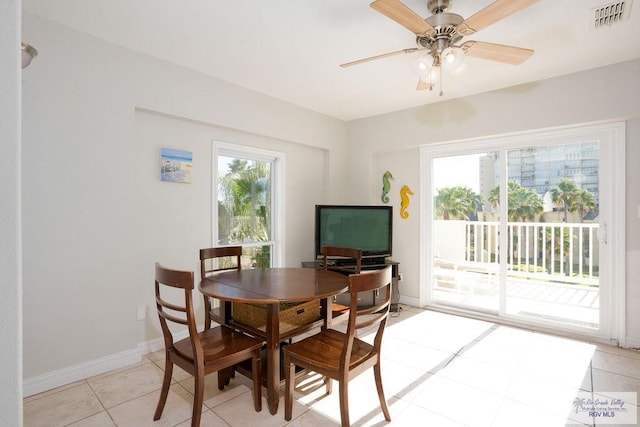 6401 Fountain Way S, Padre Island, TX 78597 - dining room with light tile patterned flooring and ceiling fan