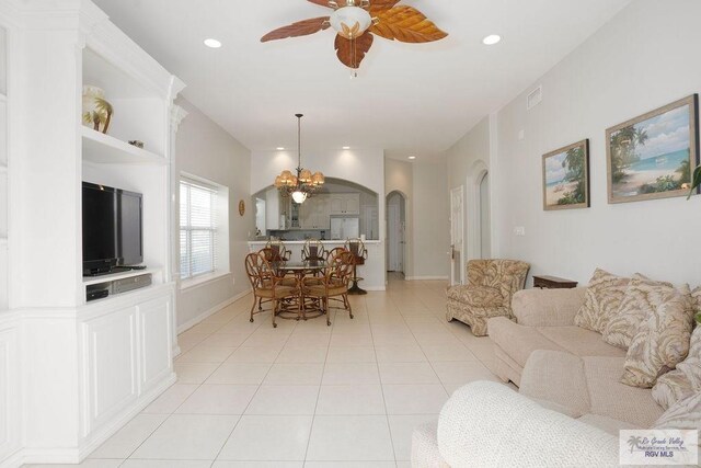 6401 Fountain Way S, Padre Island, TX 78597 - living area featuring arched walkways, light tile patterned floors, ceiling fan, a chandelier, and recessed lighting
