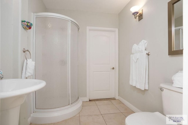 6401 Fountain Way S, Padre Island, TX 78597 - bathroom featuring a stall shower and tile patterned floors