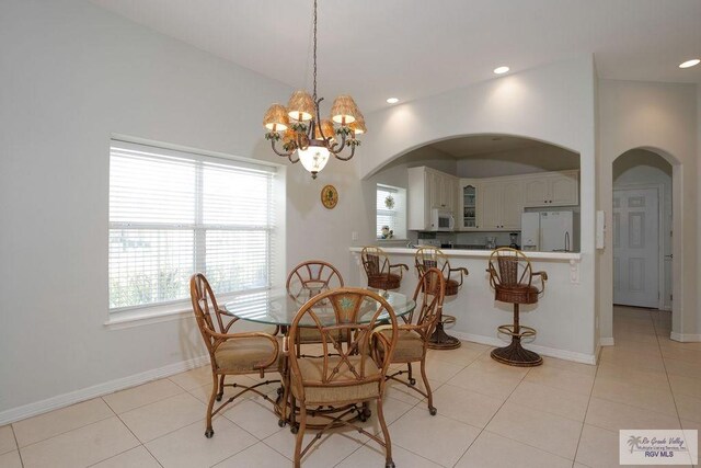 6401 Fountain Way S, Padre Island, TX 78597 - dining room with arched walkways, a chandelier, light tile patterned floors, and recessed lighting