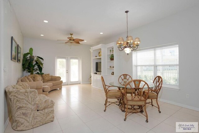 6401 Fountain Way S, Padre Island, TX 78597 - dining room featuring a ceiling fan, recessed lighting, a chandelier, light tile patterned floors, and french doors