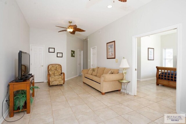 6401 Fountain Way S, Padre Island, TX 78597 - living area featuring ceiling fan, light tile patterned flooring, and vaulted ceiling