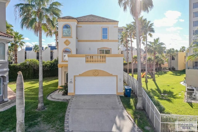 6401 Fountain Way S, Padre Island, TX 78597 - mediterranean / spanish-style house featuring an attached garage, driveway, stucco siding, a tiled roof, and a balcony