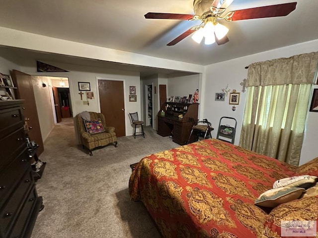 bedroom with light carpet and ceiling fan