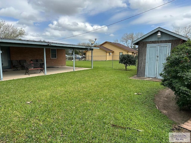 view of yard with a patio and a storage shed