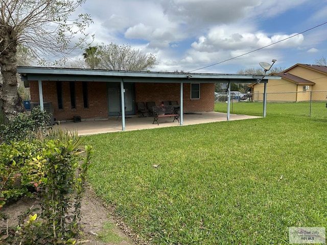 back of property with a patio, central AC, and a yard