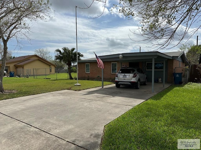 view of home's exterior with a lawn and a carport