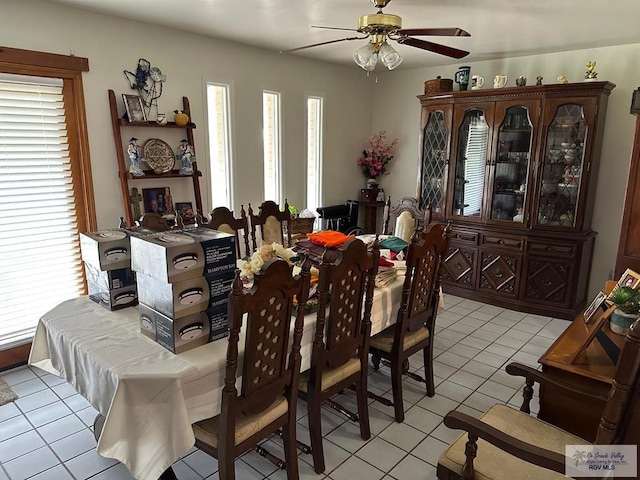 dining area featuring plenty of natural light, ceiling fan, and light tile patterned floors