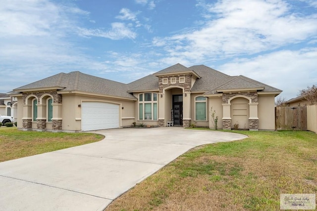 view of front of house with stone siding, stucco siding, and a garage