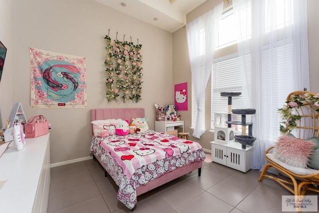 tiled bedroom with baseboards
