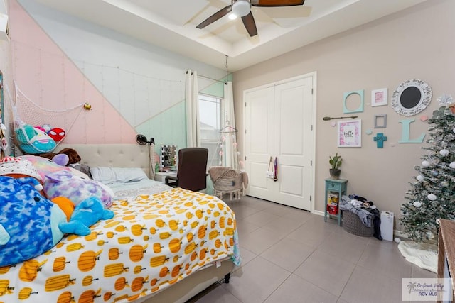 bedroom featuring tile patterned flooring and ceiling fan