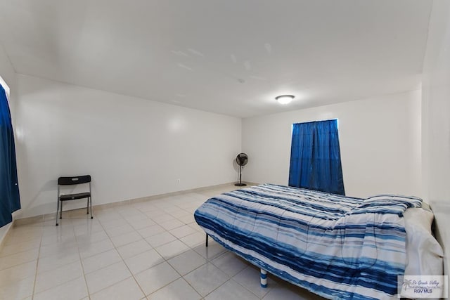 bedroom with light tile patterned floors