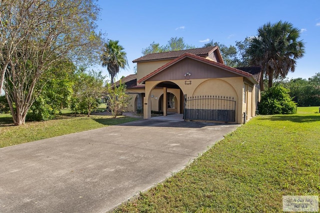 mediterranean / spanish house with a front lawn