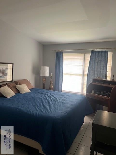 bedroom with light tile patterned floors