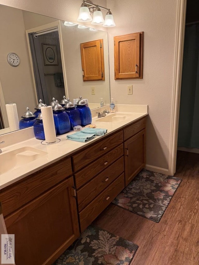 bathroom featuring vanity and wood-type flooring