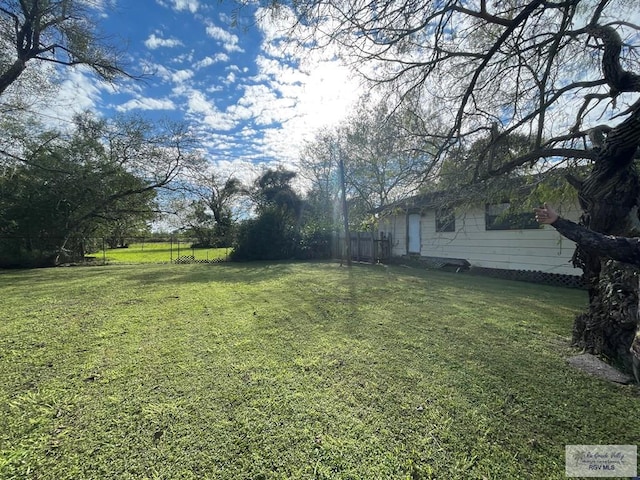 view of yard featuring fence