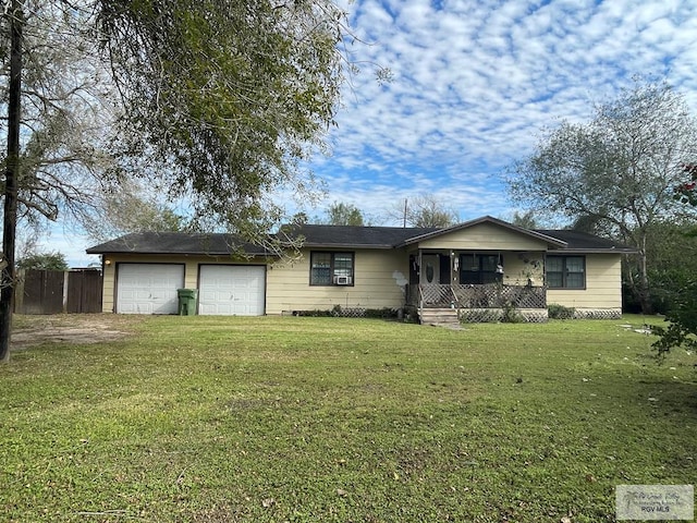 ranch-style house featuring a garage, fence, a porch, and a front yard
