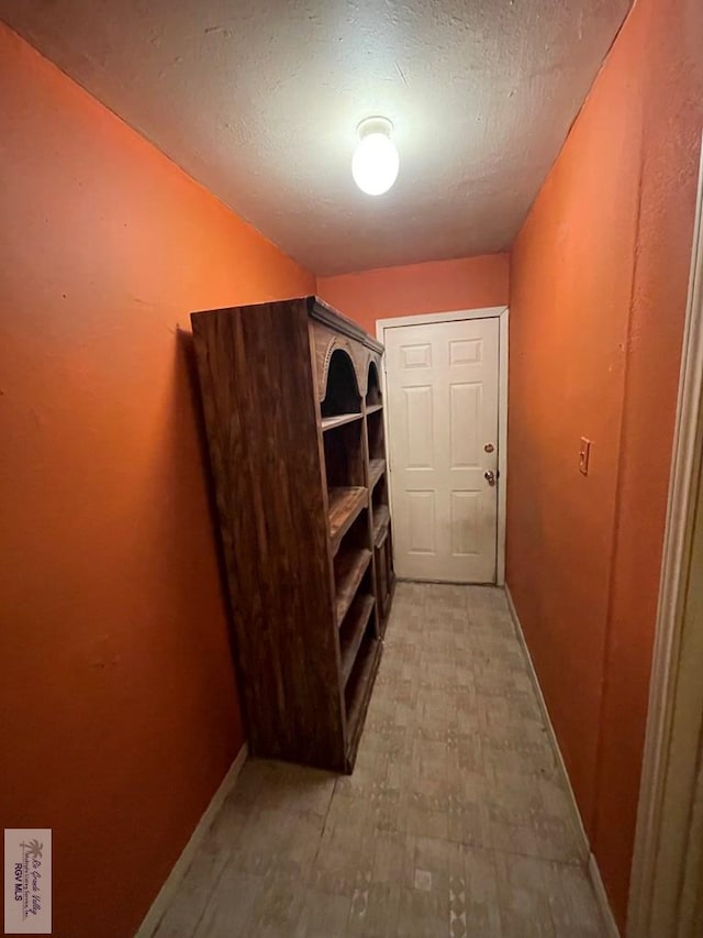 interior space with light floors and baseboards