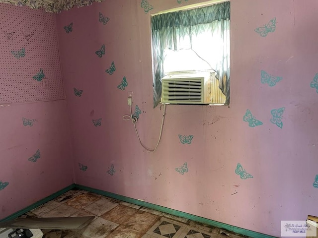 laundry area with cooling unit and baseboards