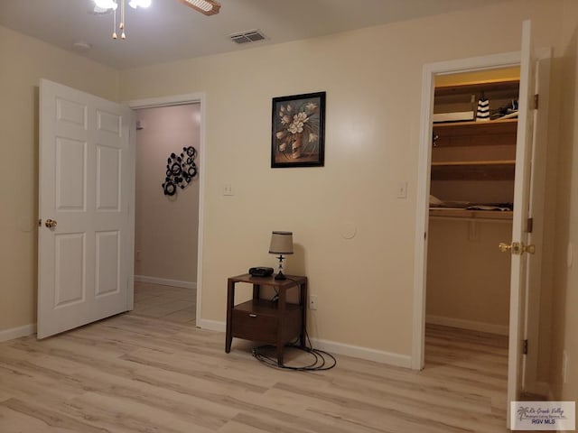 180 Chippewa Cir, Harlingen, TX 78555 - corridor featuring light wood-style flooring and baseboards