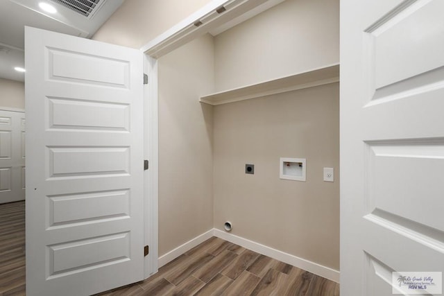 washroom with washer hookup, hookup for an electric dryer, and dark hardwood / wood-style flooring