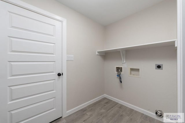 clothes washing area with hookup for an electric dryer, washer hookup, and light wood-type flooring