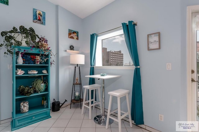 misc room with light tile patterned floors