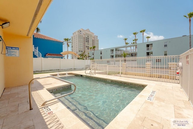 view of swimming pool featuring a patio