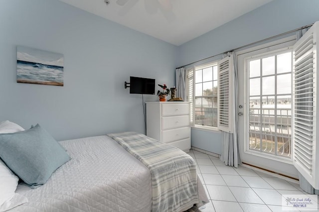 bedroom featuring light tile patterned floors and ceiling fan