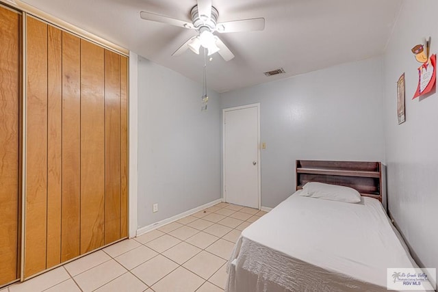 24 Ivy Ln, Brownsville, TX 78521 - bedroom with light tile patterned floors, a closet, and a ceiling fan