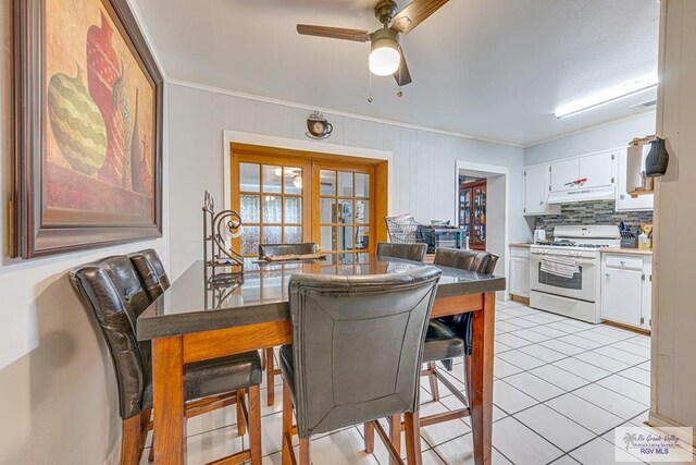 24 Ivy Ln, Brownsville, TX 78521 - dining area with crown molding, ceiling fan, and light tile patterned floors