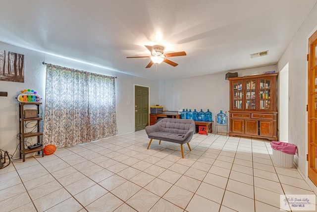 24 Ivy Ln, Brownsville, TX 78521 - sitting room with ceiling fan and light tile patterned flooring
