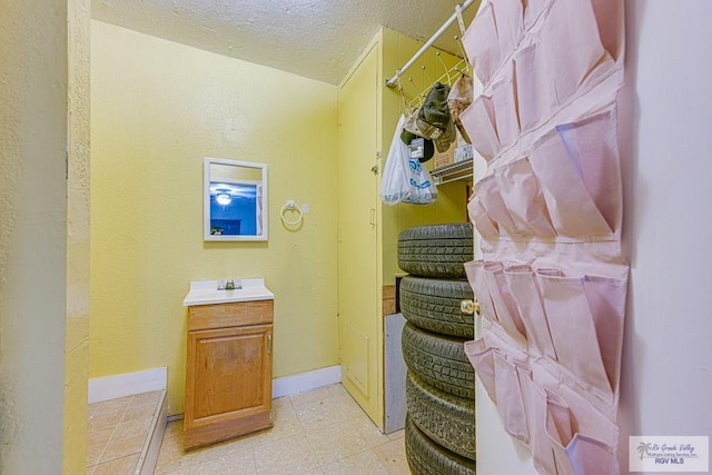 24 Ivy Ln, Brownsville, TX 78521 - bathroom featuring vanity and a textured ceiling