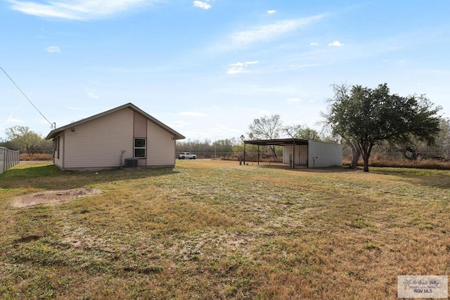 view of yard with central AC unit