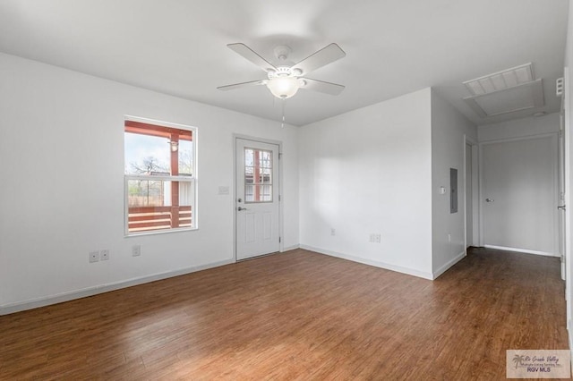 empty room with dark wood-type flooring and ceiling fan