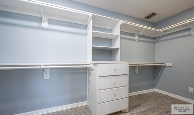 5906 Sunrise Blvd, Harlingen, TX 78552 - spacious closet featuring wood finished floors