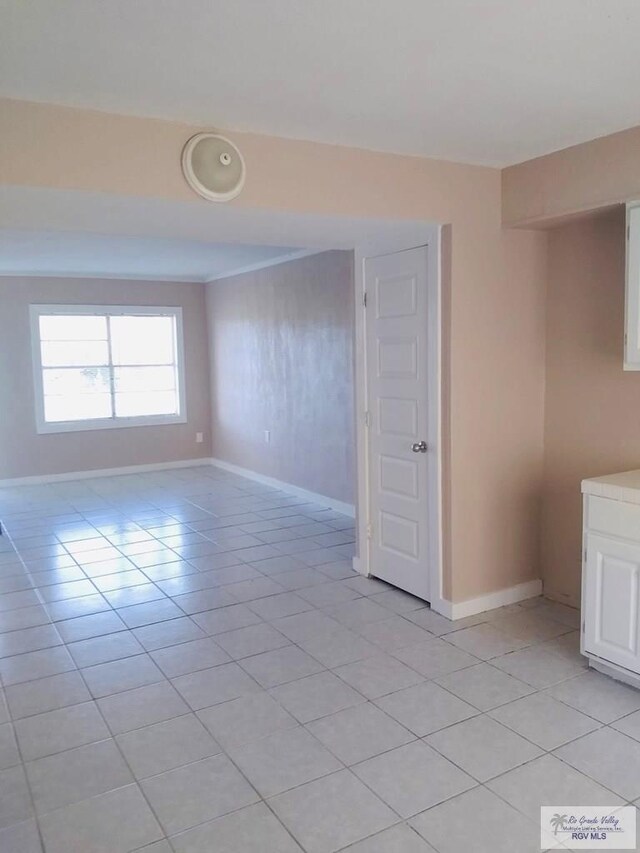 5824 Southmost Rd, Brownsville, TX 78521 - unfurnished room featuring baseboards and light tile patterned floors