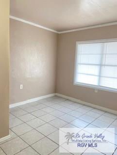5824 Southmost Rd, Brownsville, TX 78521 - empty room featuring baseboards and light tile patterned floors