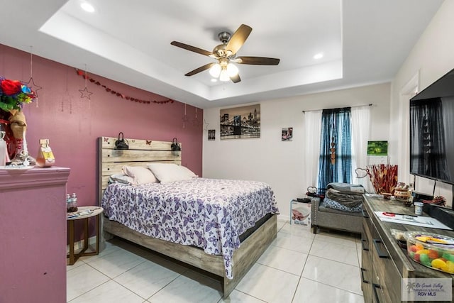 bedroom with light tile patterned floors, ceiling fan, a raised ceiling, and recessed lighting